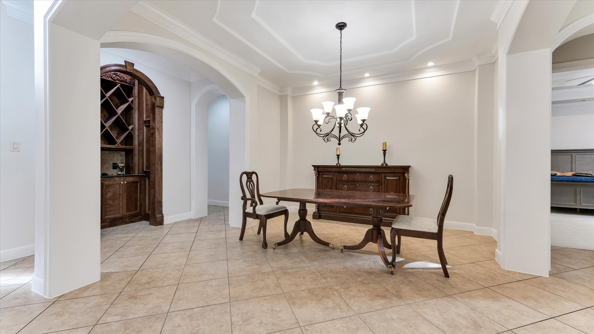 3 North Fair Manor Circle Spring, TX 77382 - Photo 7 of 39 a view of a dining room with furniture and chandelier