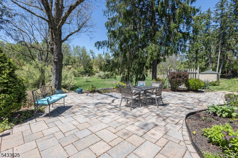 449 Stamets Road Milford, NJ 08848 - Photo 4 of 44 a view of a patio with table and chairs with plants and large trees
