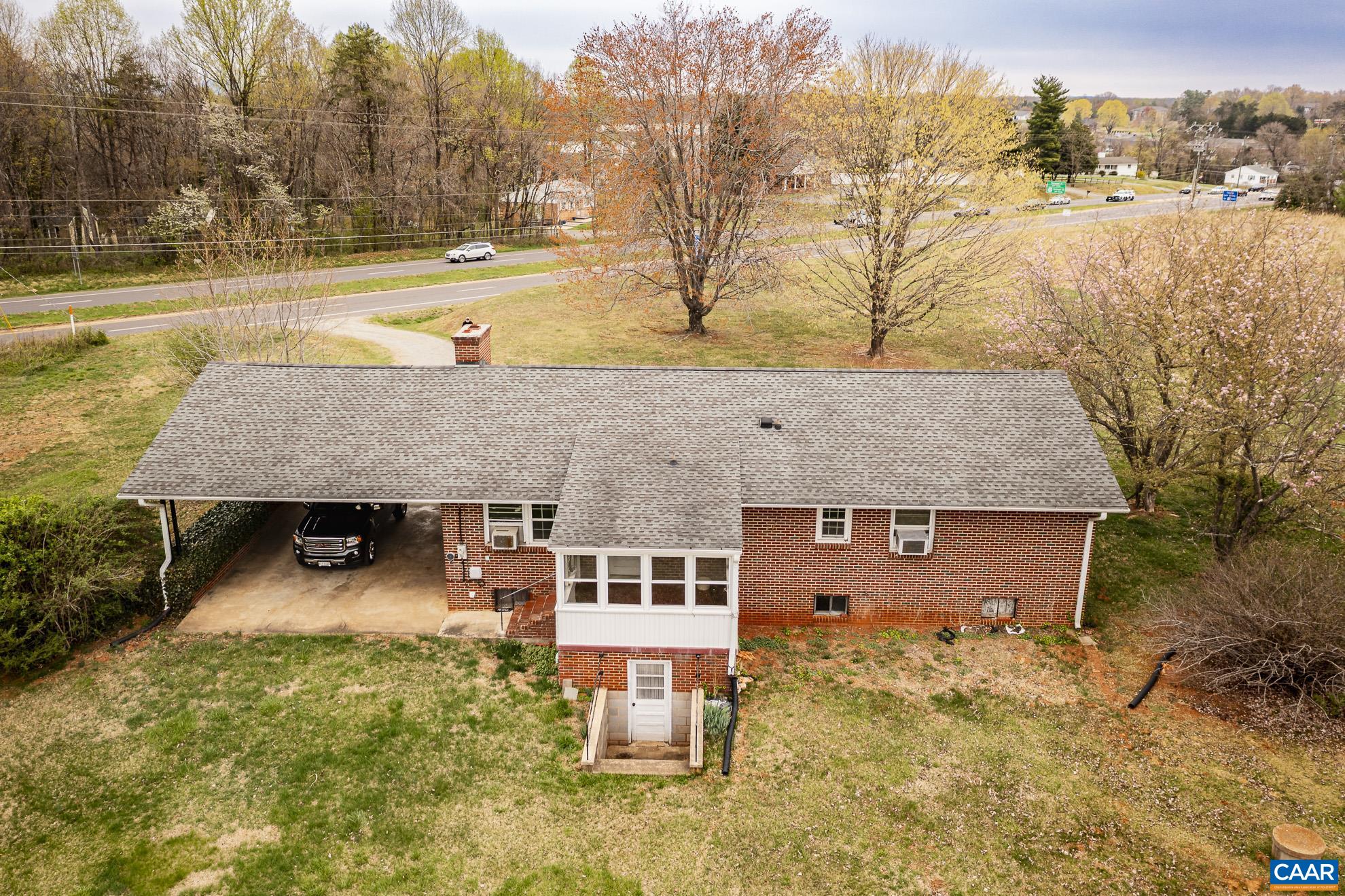 14540 Spotswood Trail Ruckersville, VA 22968 - Photo 41 of 42 a view of a house with a yard covered in snow
