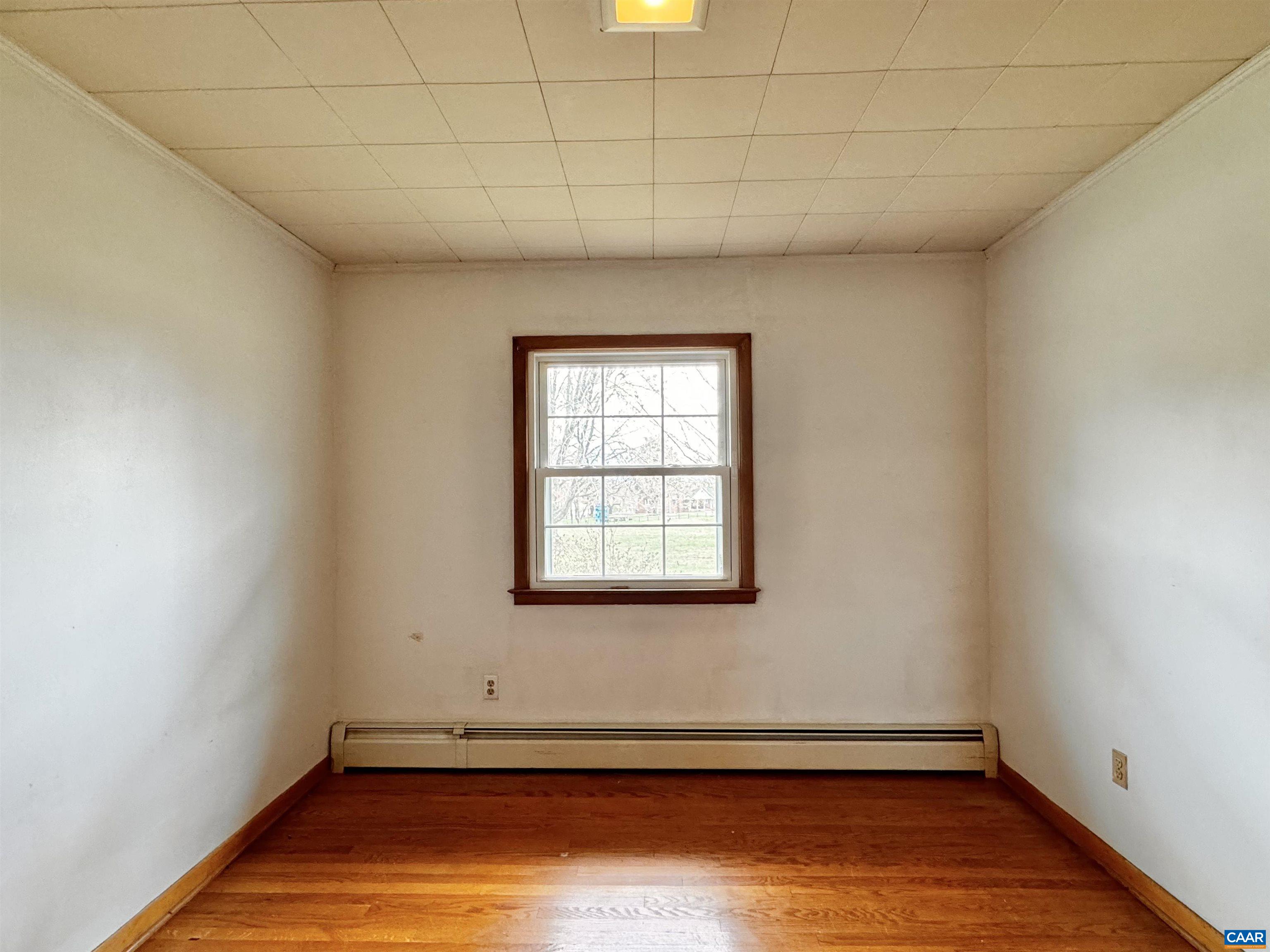 14540 Spotswood Trail Ruckersville, VA 22968 - Photo 9 of 42 a view of a room with wooden floor and window