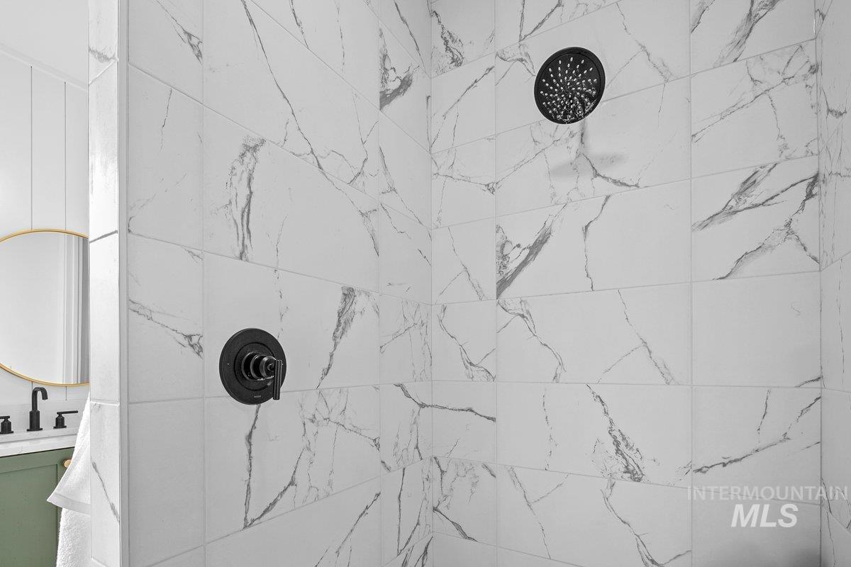 1911 East Mainacht Street Meridian, ID 83642 - Photo 30 of 49 Bathroom with a tile shower and vanity