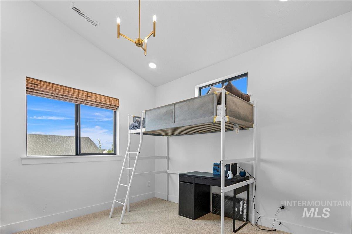 1911 East Mainacht Street Meridian, ID 83642 - Photo 35 of 49 Bedroom with light colored carpet, vaulted ceiling, and recessed lighting