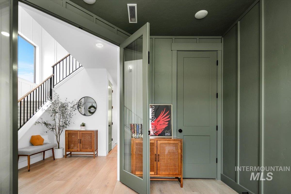 1911 East Mainacht Street Meridian, ID 83642 - Photo 10 of 49 Hallway with light wood-style floors and stairs
