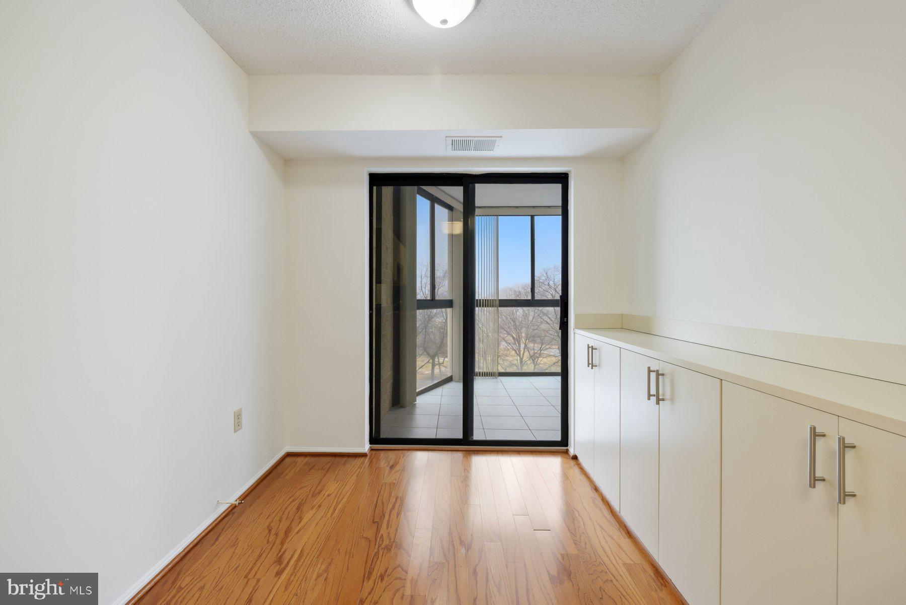 15107 Interlachen Drive, Unit 2801 Silver Spring, MD 20906 - Photo 19 of 50 wooden floor in an empty room with a window