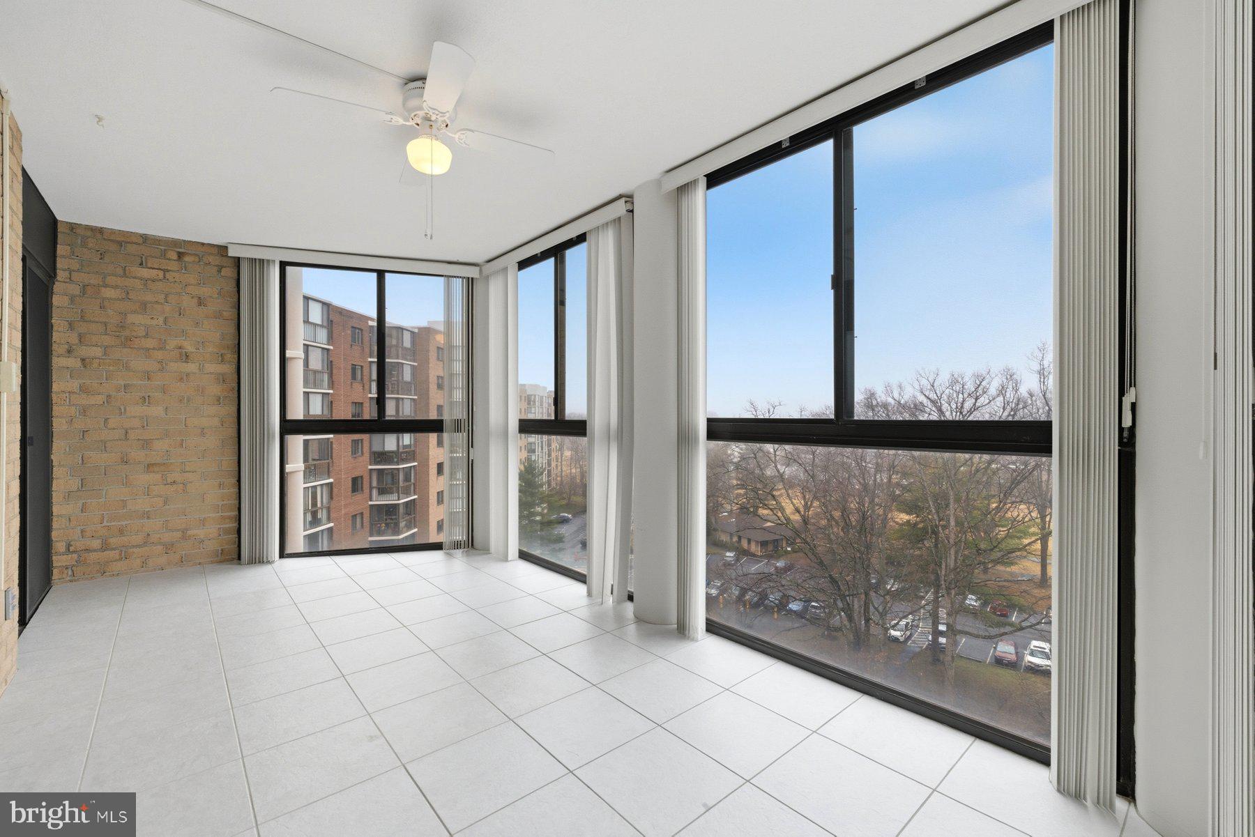 15107 Interlachen Drive, Unit 2801 Silver Spring, MD 20906 - Photo 22 of 50 a view of empty room with floor to ceiling windows
