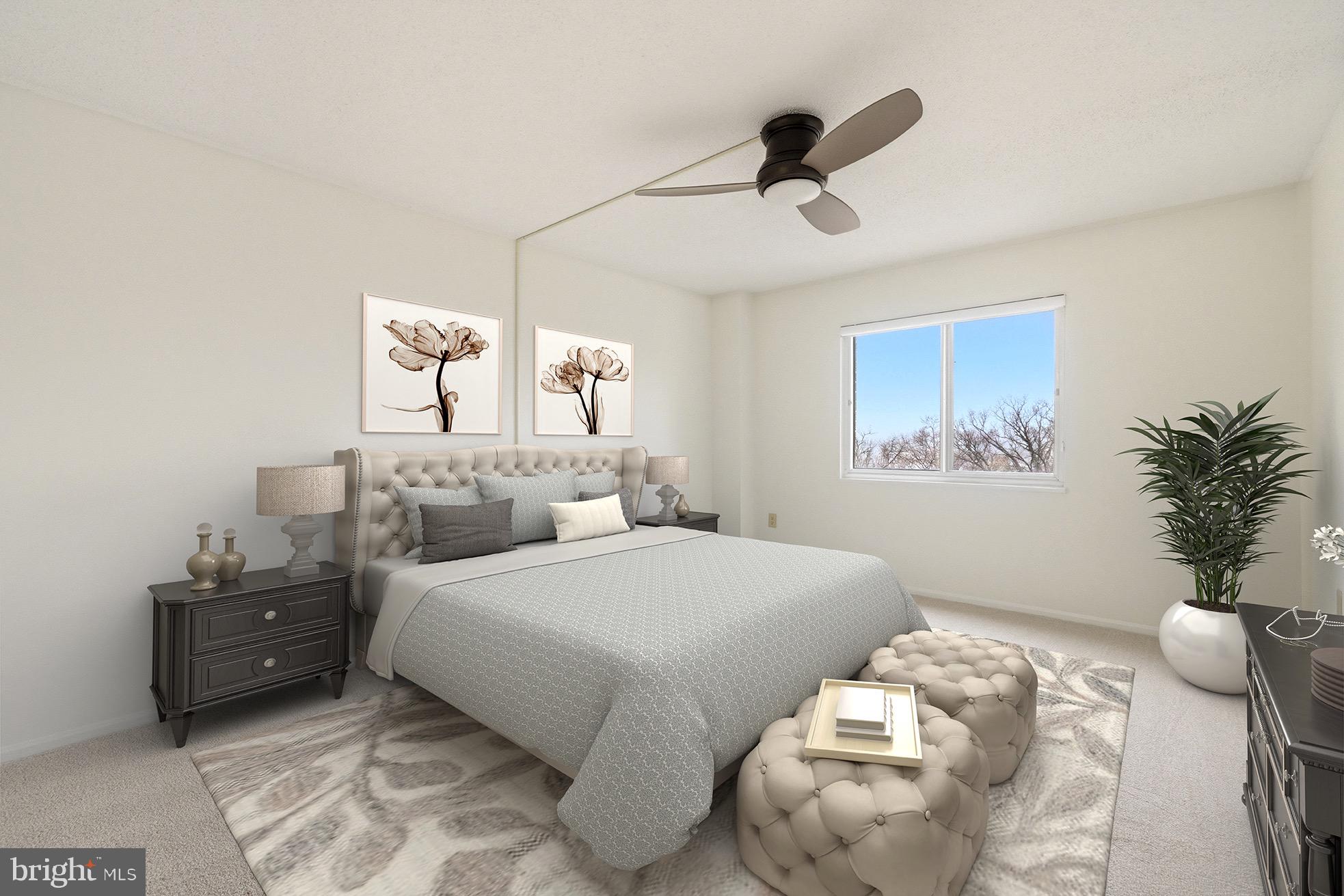 15107 Interlachen Drive, Unit 2801 Silver Spring, MD 20906 - Photo 27 of 50 a bedroom with bed and a chandelier