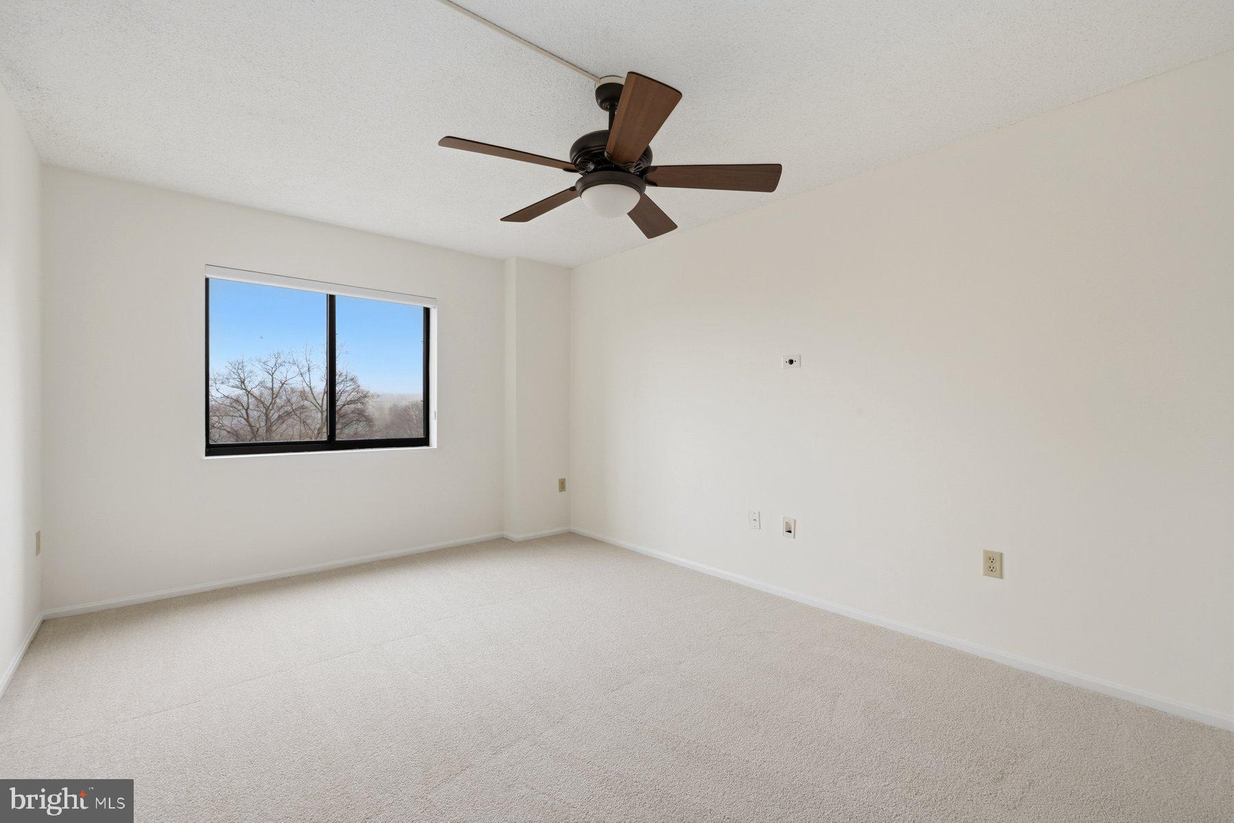 15107 Interlachen Drive, Unit 2801 Silver Spring, MD 20906 - Photo 33 of 50 an empty room with fan