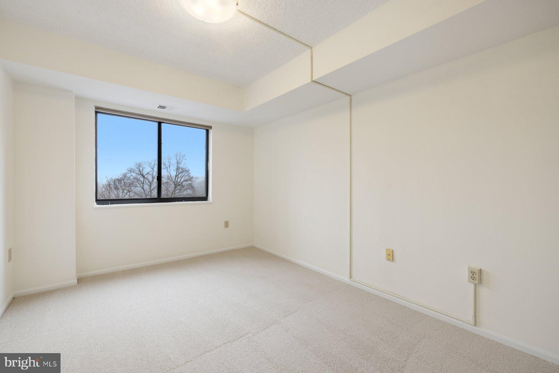 15107 Interlachen Drive, Unit 2801 Silver Spring, MD 20906 - Photo 37 of 50 a view of an empty room with a window