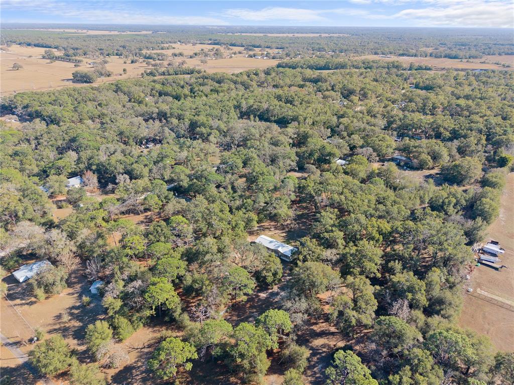 0 Deason Drive Spring Hill, FL 34610 - Photo 4 of 7 an aerial view of a houses with a yard