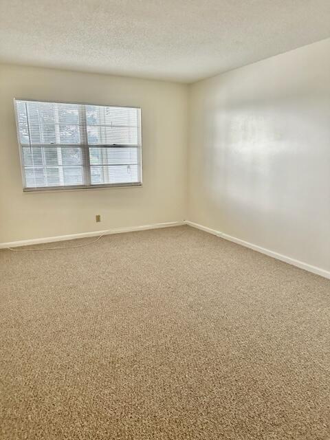3063 Ainslie Drive Boca Raton, FL 33434 - Photo 7 of 33 an empty room with windows