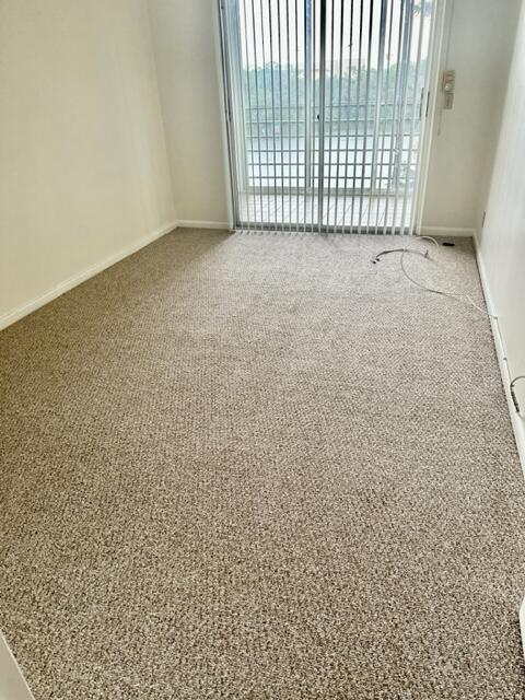 3063 Ainslie Drive Boca Raton, FL 33434 - Photo 9 of 33 a view of an empty room with a window