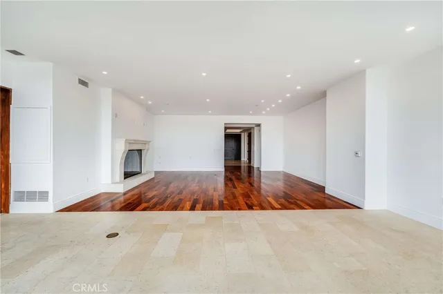 a view of livingroom with hardwood floor and fireplace