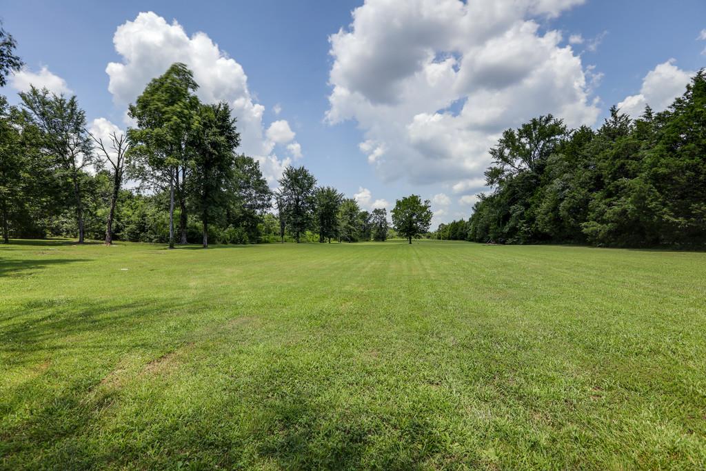 1100 Allen Road Murfreesboro, TN 37129 - Photo 29 of 30 a view of a grassy field with plants in back