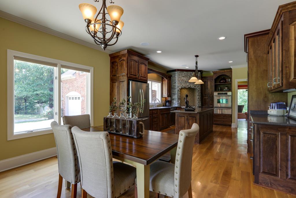 1100 Allen Road Murfreesboro, TN 37129 - Photo 7 of 30 a view of a dining room with furniture a chandelier and wooden floor