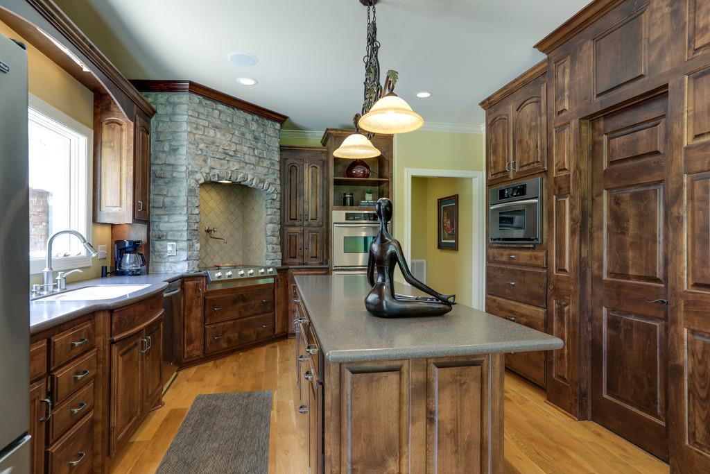 1100 Allen Road Murfreesboro, TN 37129 - Photo 9 of 30 a kitchen with stainless steel appliances granite countertop a sink a stove and a refrigerator
