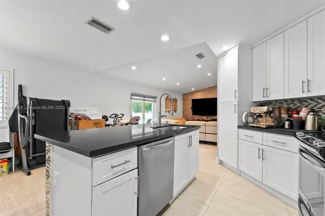 a kitchen with a sink and cabinets