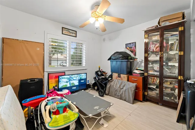 a bedroom with furniture and a window