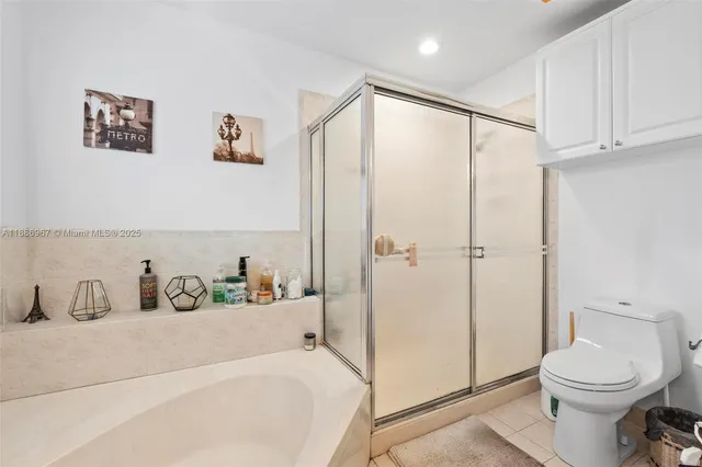 a bathroom with a toilet sink and shower