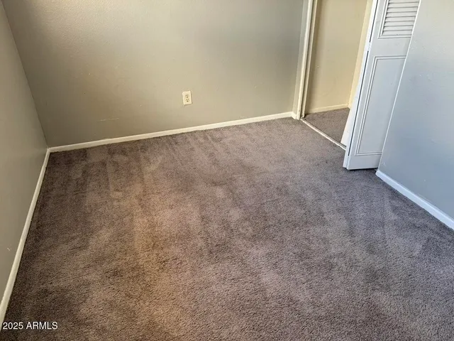 an empty room with an entrance door