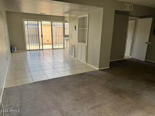 an empty room with entrance door