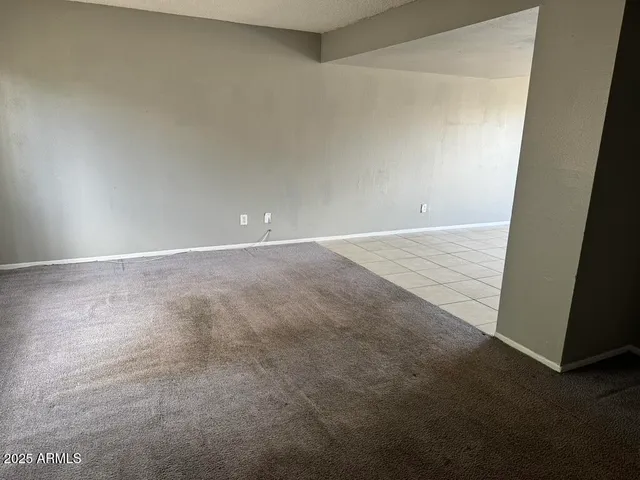 a utility room with cabinets washer and dryer