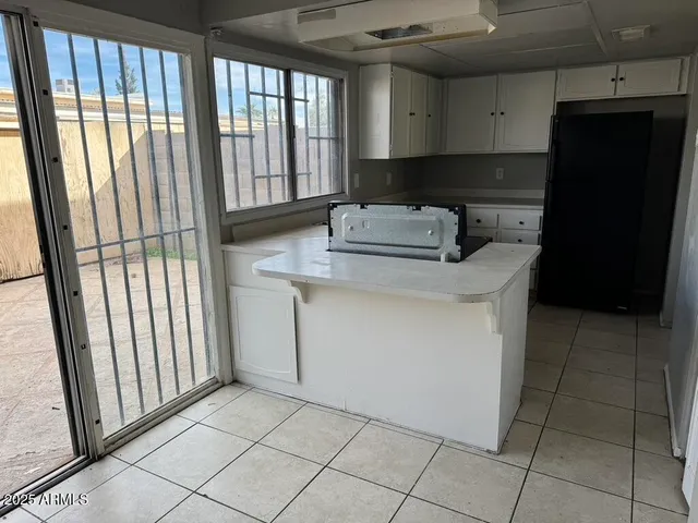a kitchen with a sink and a window