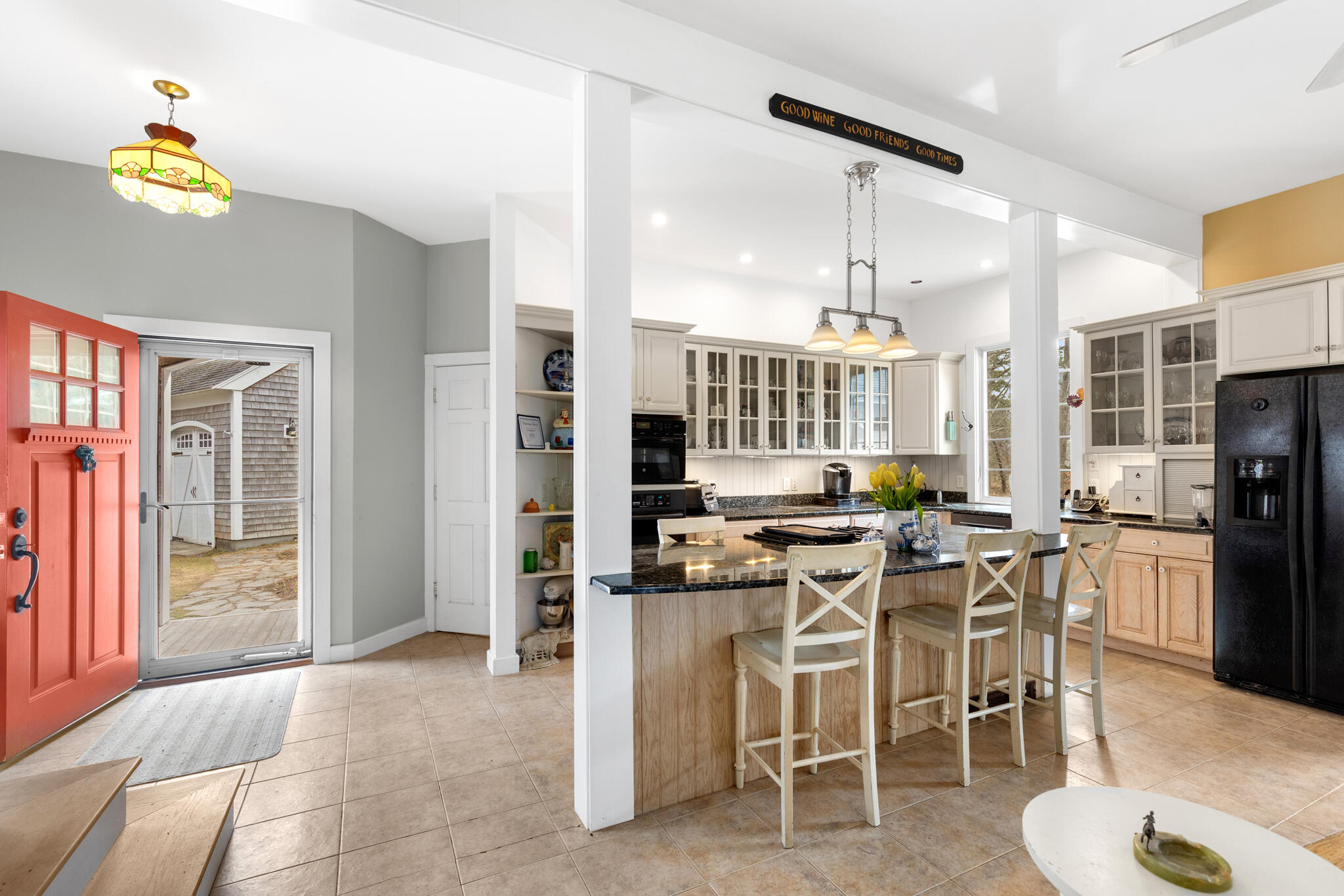 311 South Sunken Meadow Road Eastham, MA 02642 - Photo 11 of 57 a kitchen with stainless steel appliances granite countertop a stove top oven a sink a dining table and chairs