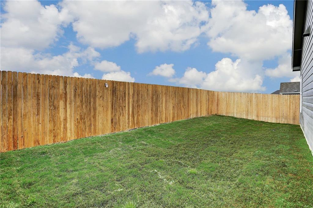 251 Geode Glen Maxwell, TX 78656 - Photo 13 of 16 a view of a backyard