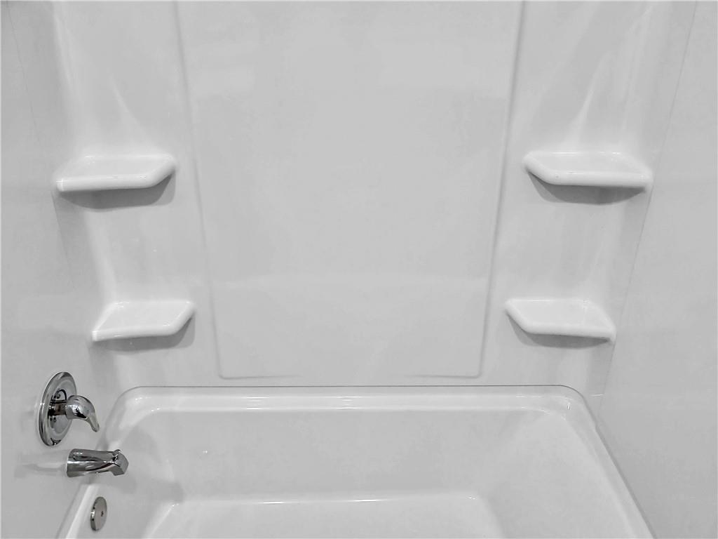 251 Geode Glen Maxwell, TX 78656 - Photo 14 of 16 a bathroom with a shower