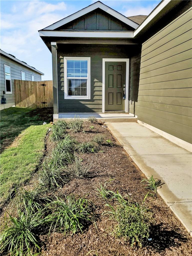 251 Geode Glen Maxwell, TX 78656 - Photo 6 of 16 a front view of a house with garden