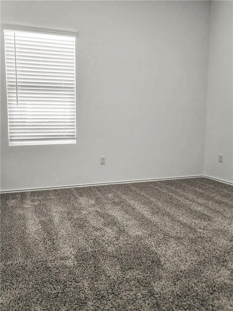 251 Geode Glen Maxwell, TX 78656 - Photo 8 of 16 an empty room with a window
