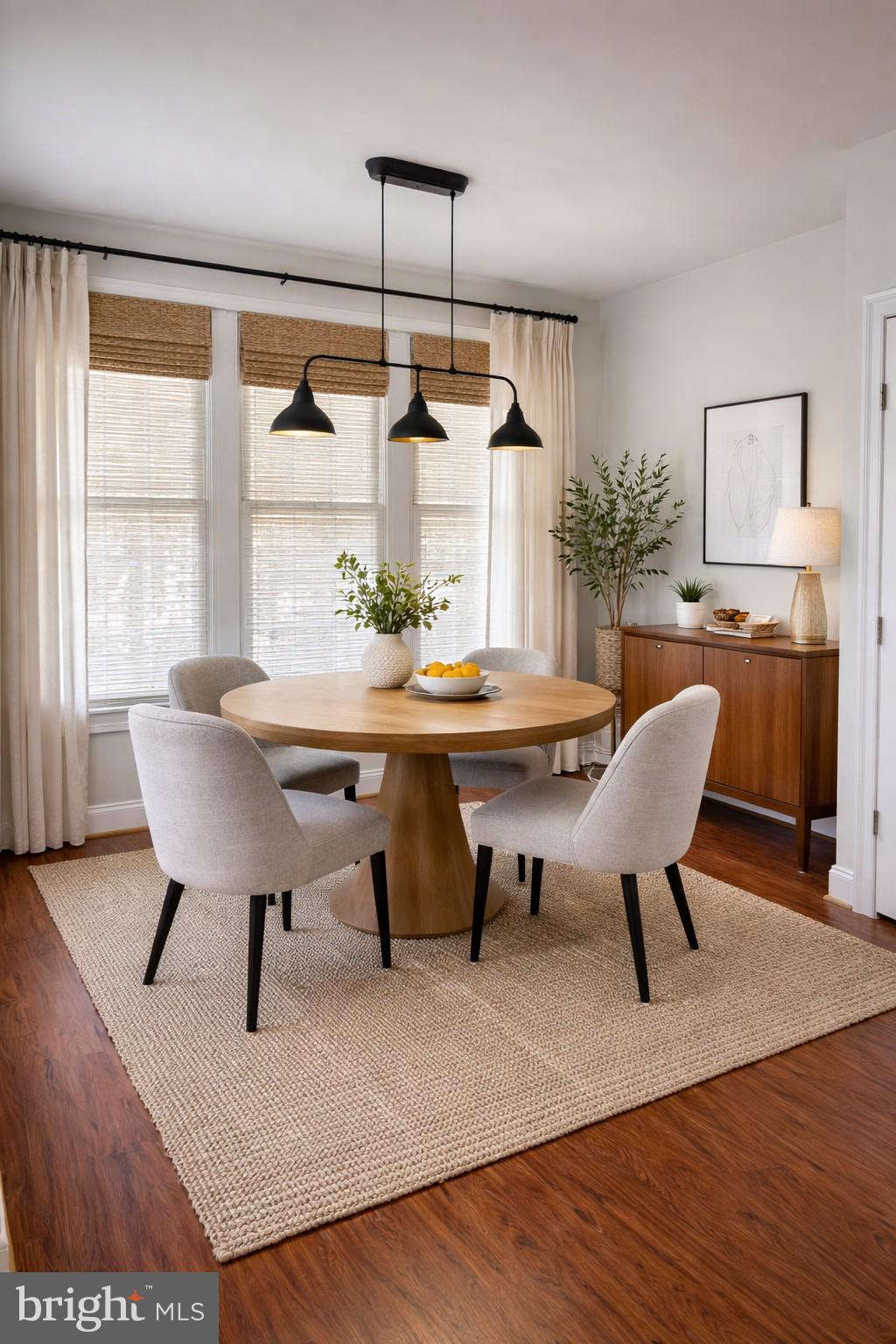 6872 Witton Circle Gainesville, VA 20155 - Photo 11 of 22 a view of a dining room with furniture window and wooden floor