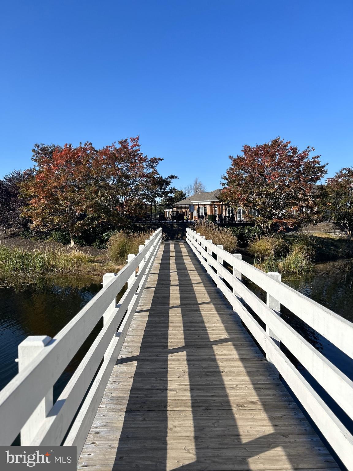 6872 Witton Circle Gainesville, VA 20155 - Photo 17 of 22 a view of a balcony with wooden floor and lake view