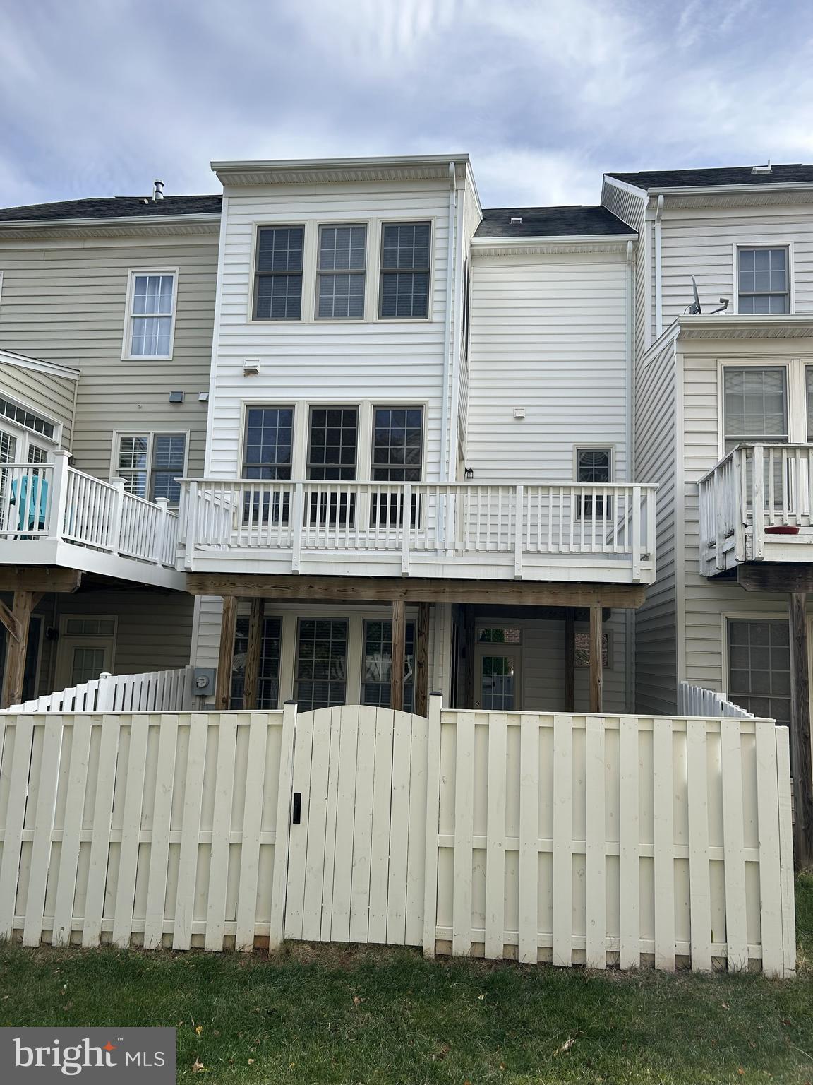6872 Witton Circle Gainesville, VA 20155 - Photo 2 of 22 a view of a large building with a yard