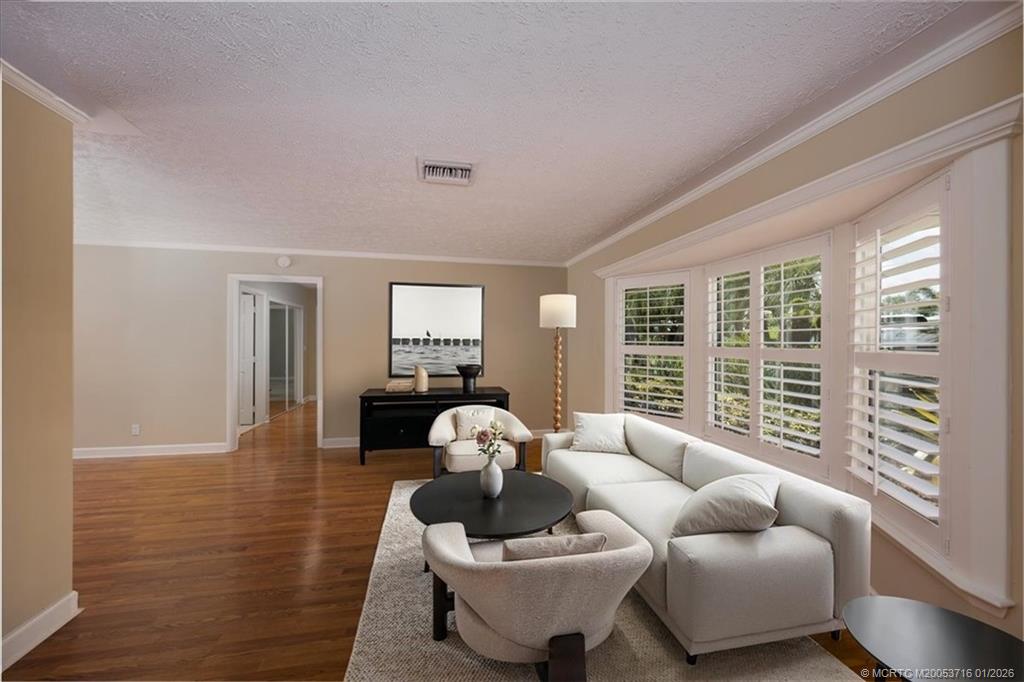 511 Krueger Parkway Stuart, FL 34996 - Photo 13 of 56 a living room with furniture and a large window