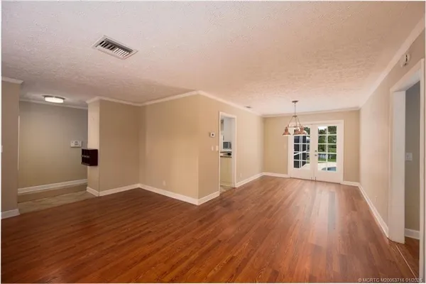 a kitchen with stainless steel appliances granite countertop white cabinets stove a sink and dishwasher