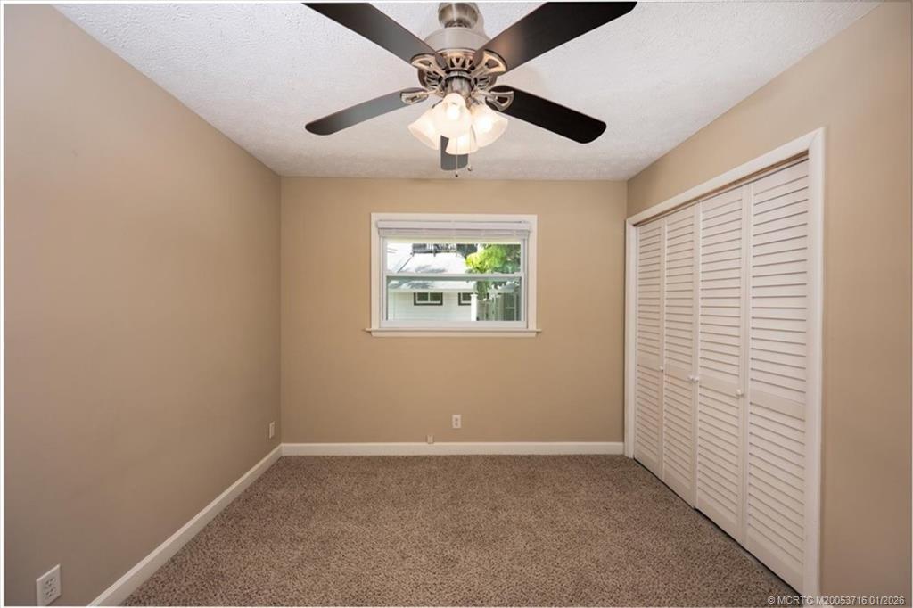 511 Krueger Parkway Stuart, FL 34996 - Photo 33 of 56 a view of an empty room with a window