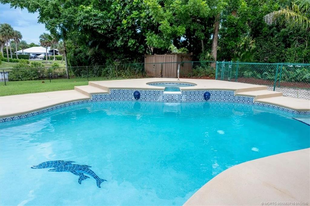 511 Krueger Parkway Stuart, FL 34996 - Photo 41 of 56 a view of a swimming pool with a yard