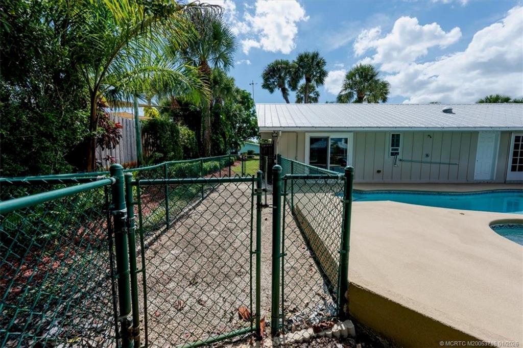 511 Krueger Parkway Stuart, FL 34996 - Photo 44 of 56 a view of a house with backyard and sitting area