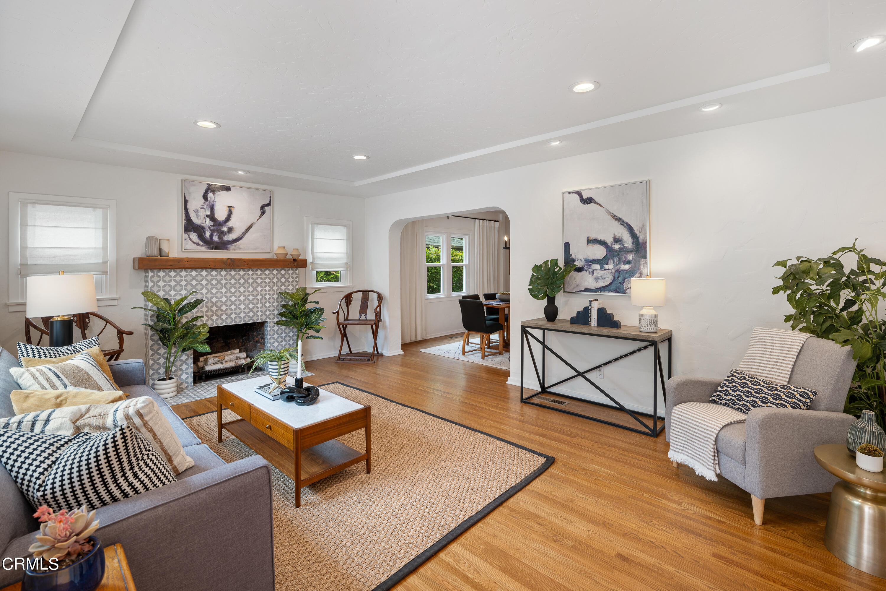 488 Colman Street Altadena, CA 91001 - Photo 13 of 75 a living room with fireplace furniture rug and wooden floor