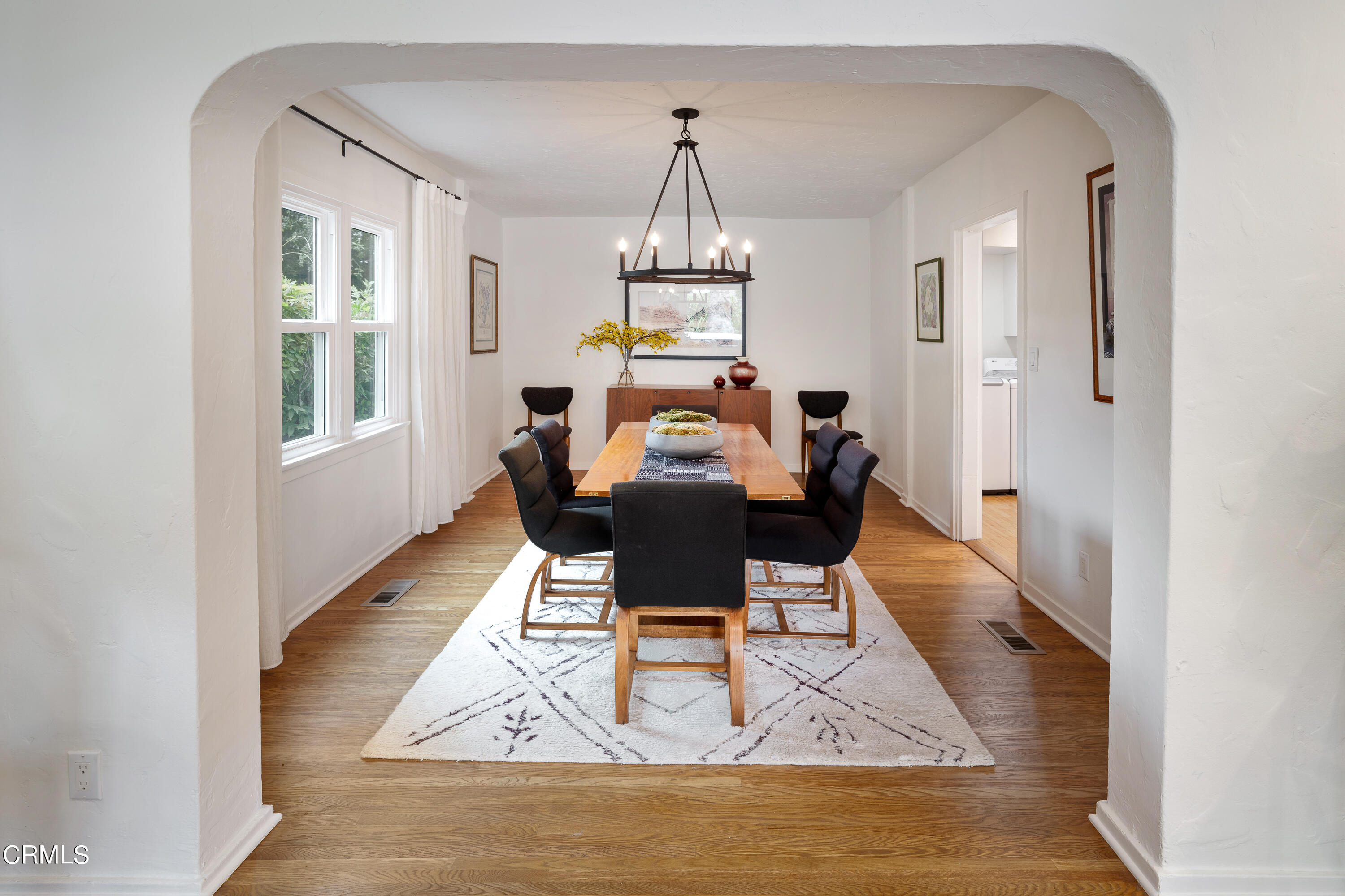 488 Colman Street Altadena, CA 91001 - Photo 14 of 75 a dining room with wooden floor a glass table and chairs