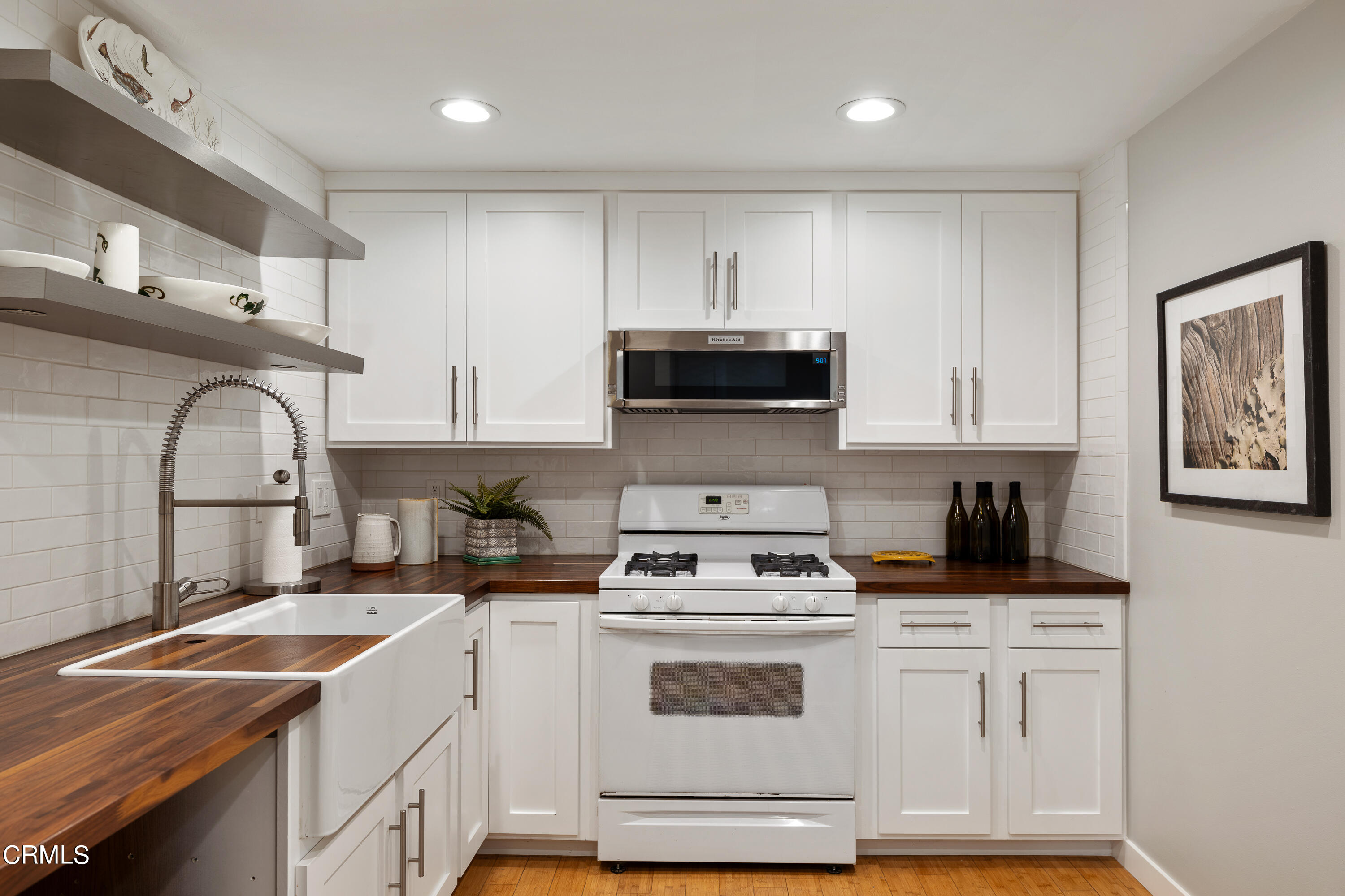 488 Colman Street Altadena, CA 91001 - Photo 19 of 75 a kitchen with cabinets appliances a sink and a counter top space