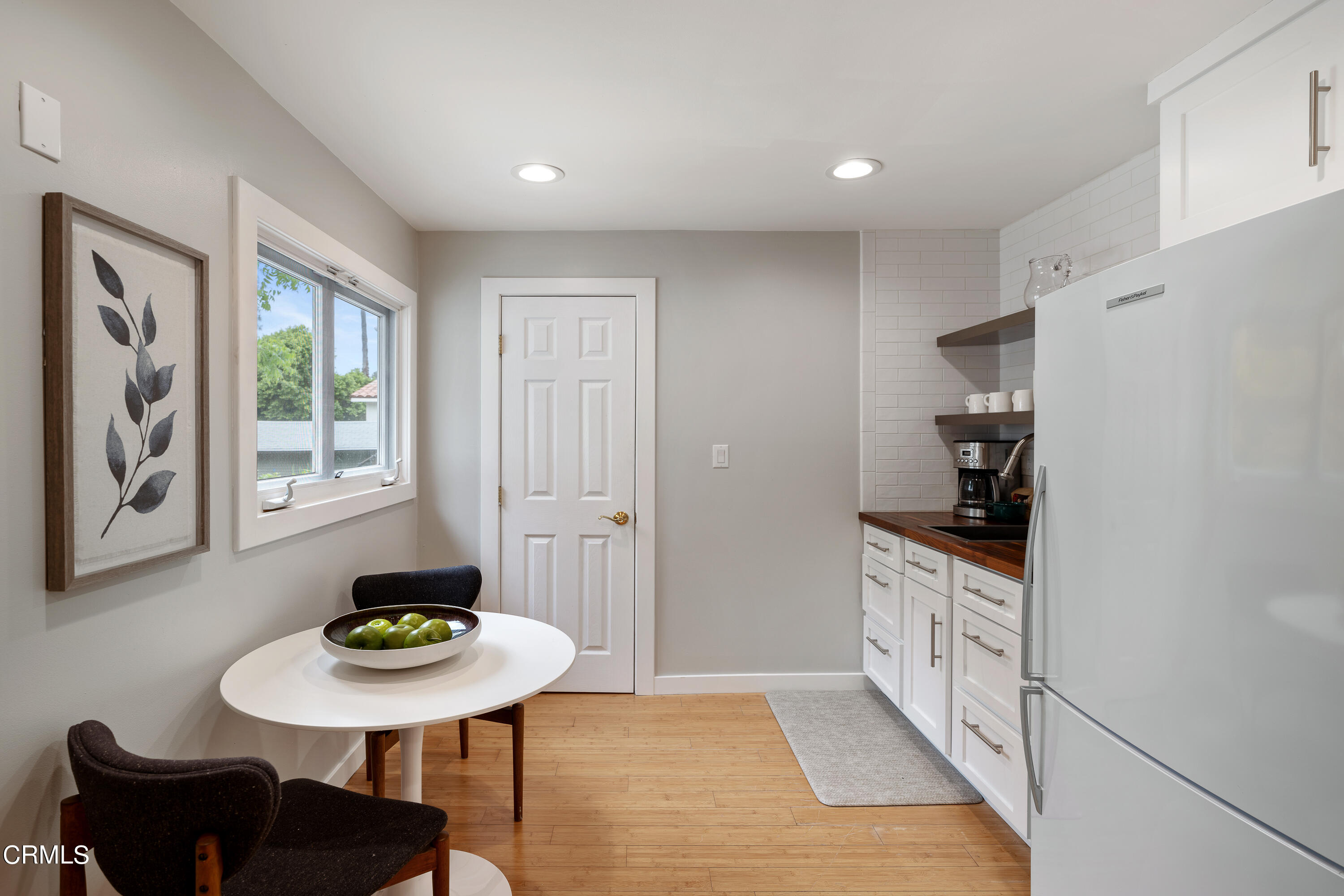 488 Colman Street Altadena, CA 91001 - Photo 24 of 75 a kitchen with stainless steel appliances a sink a stove a refrigerator a dining table and chairs