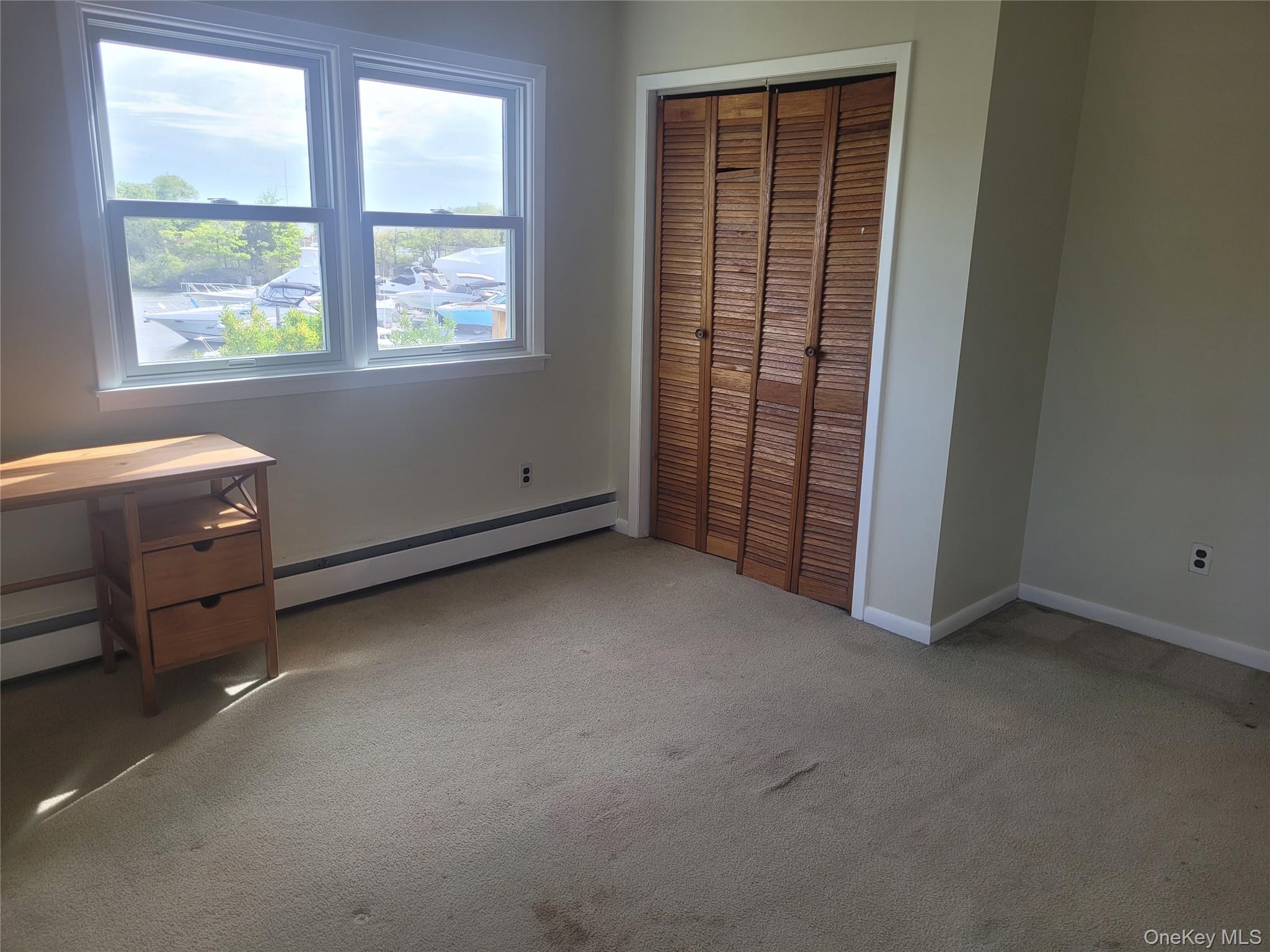 8 Cornell Road East Patchogue, NY 11772 - Photo 14 of 18 an empty room with windows