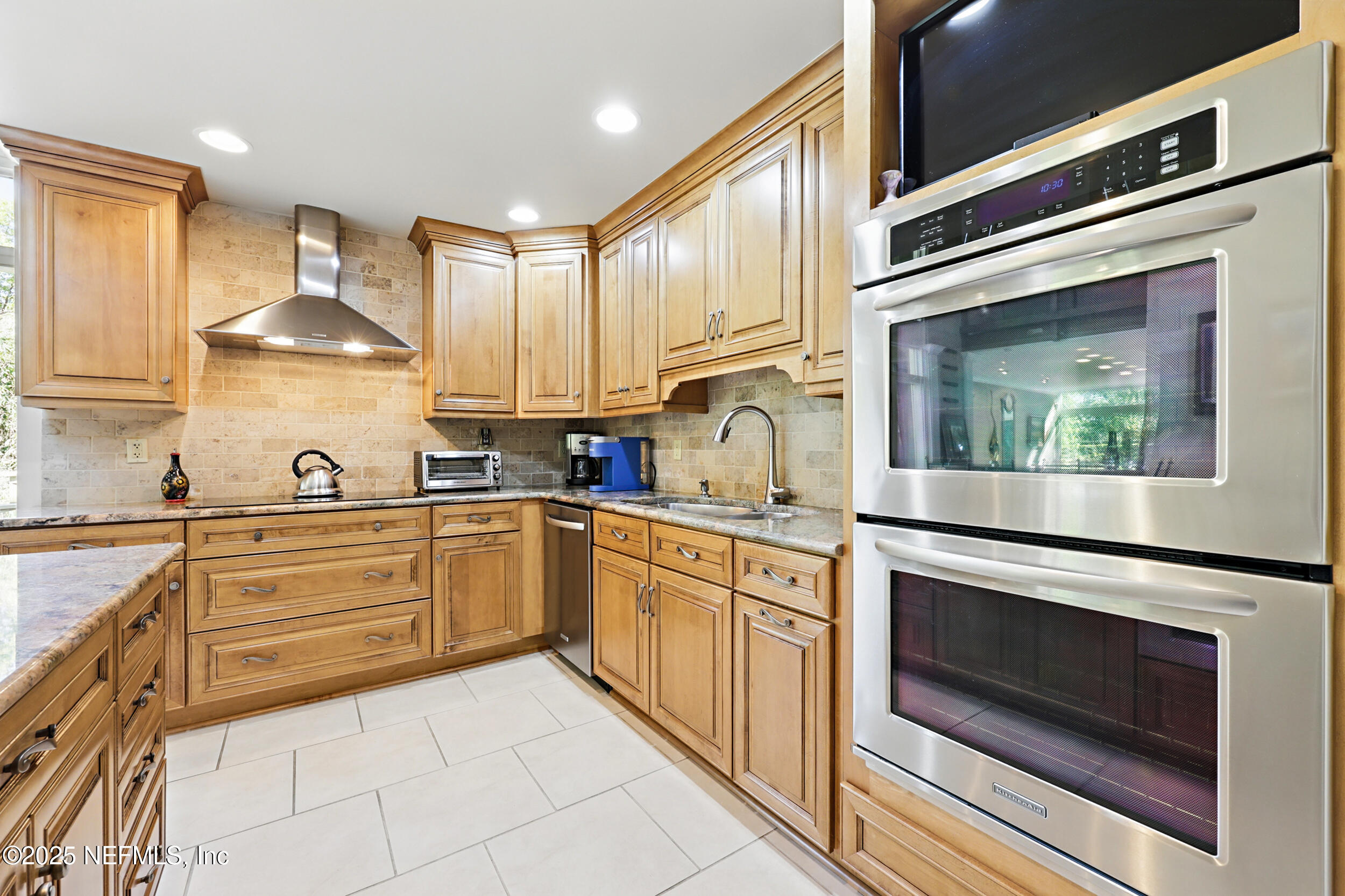 2916 Forest Circle Jacksonville, FL 32257 - Photo 15 of 64 a kitchen with stainless steel appliances granite countertop a stove and white cabinets