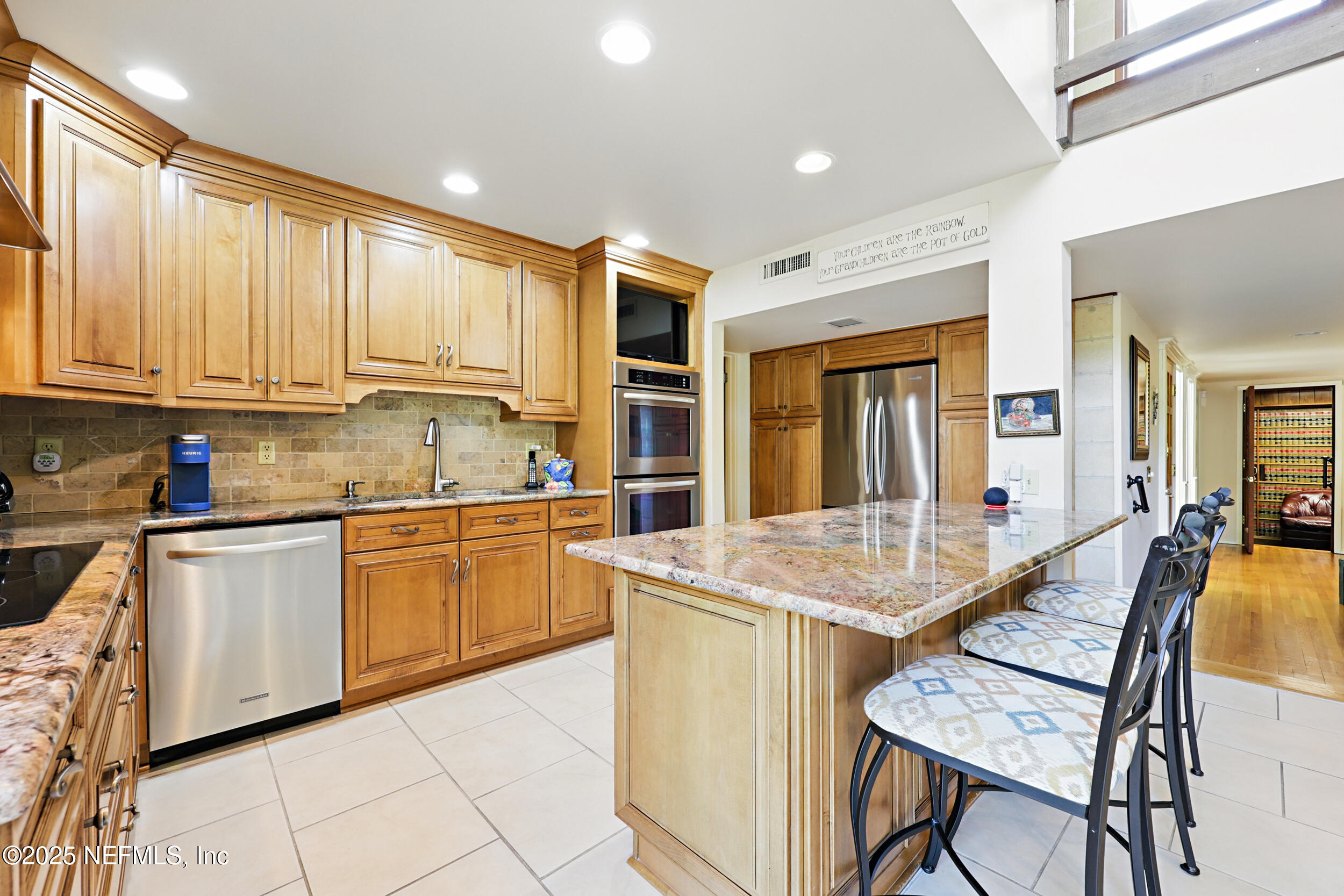 2916 Forest Circle Jacksonville, FL 32257 - Photo 18 of 64 a kitchen with stainless steel appliances granite countertop a stove top oven a sink dishwasher and white cabinets with wooden floor