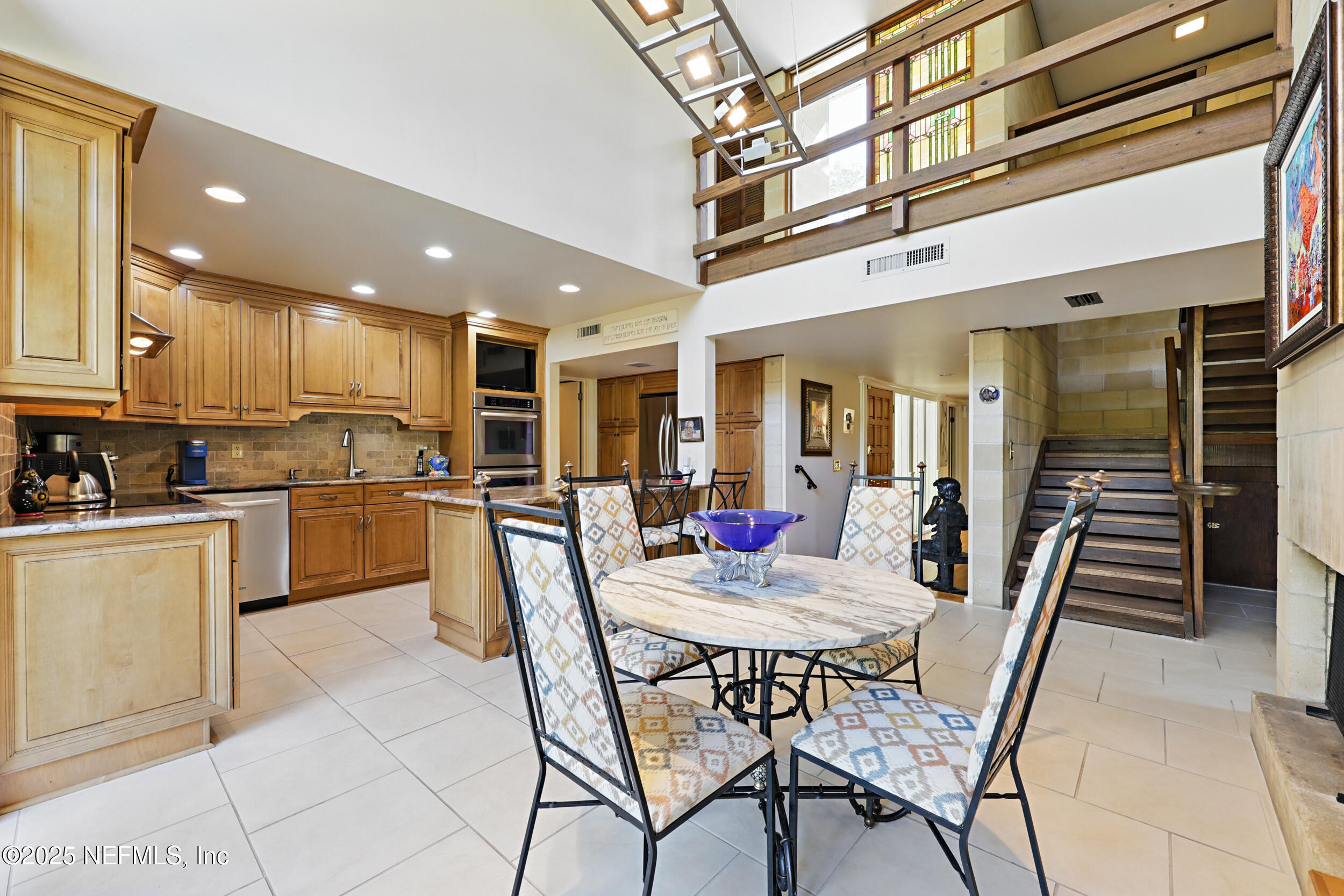 2916 Forest Circle Jacksonville, FL 32257 - Photo 25 of 64 a kitchen with stainless steel appliances kitchen island granite countertop a dining table chairs and granite counter tops
