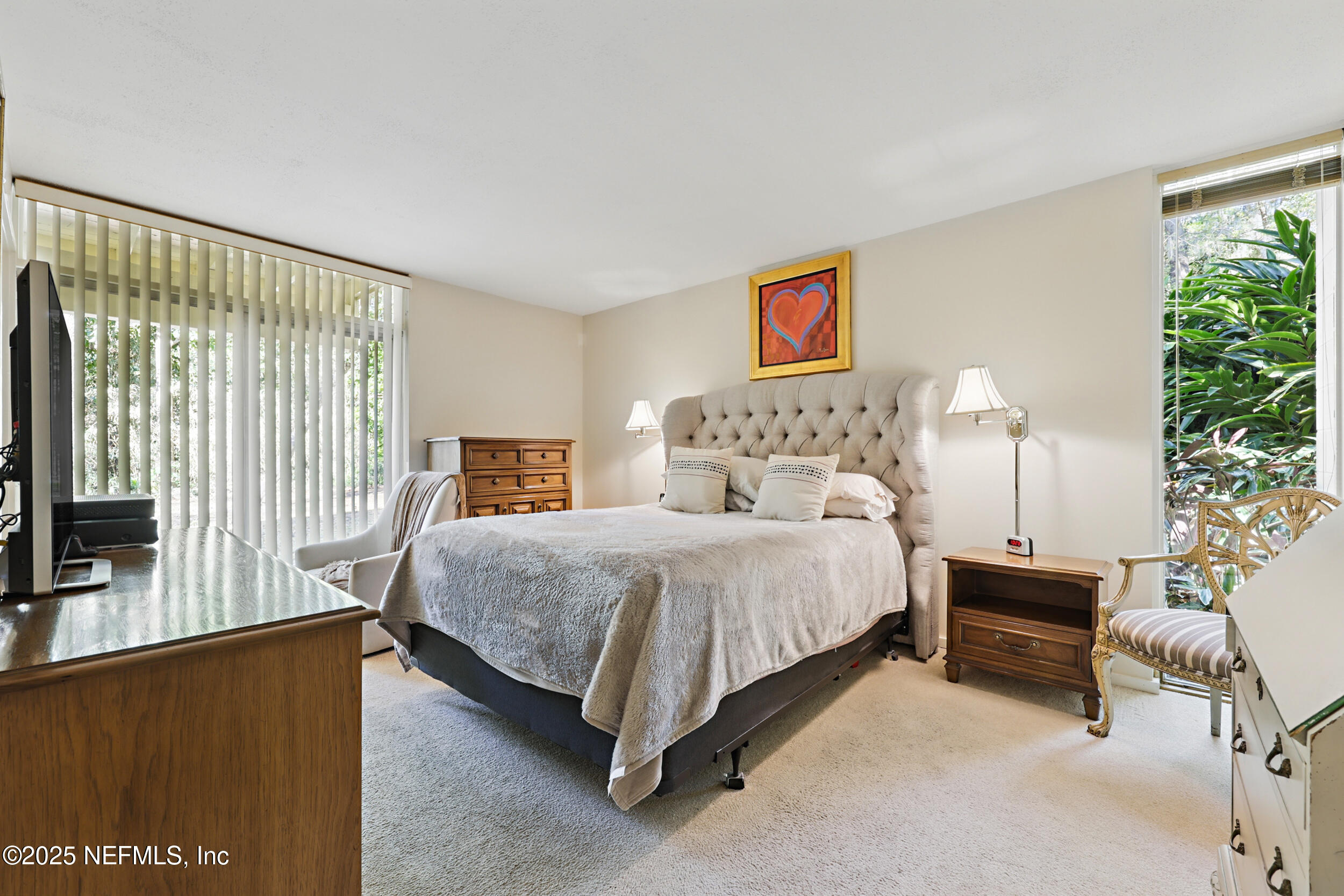 2916 Forest Circle Jacksonville, FL 32257 - Photo 32 of 64 a bedroom with a bed and a flat screen tv