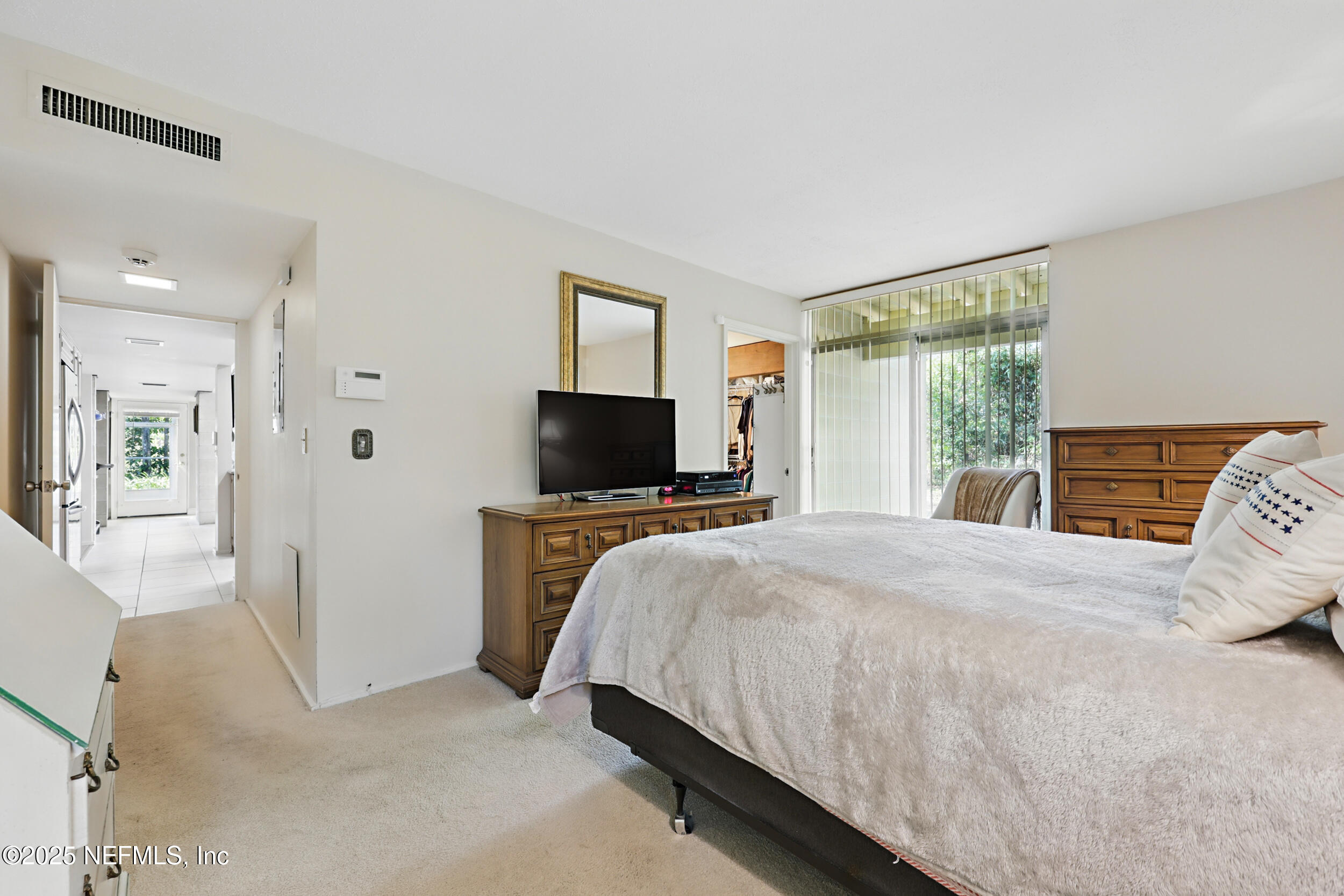 2916 Forest Circle Jacksonville, FL 32257 - Photo 33 of 64 a bedroom with a bed and a television