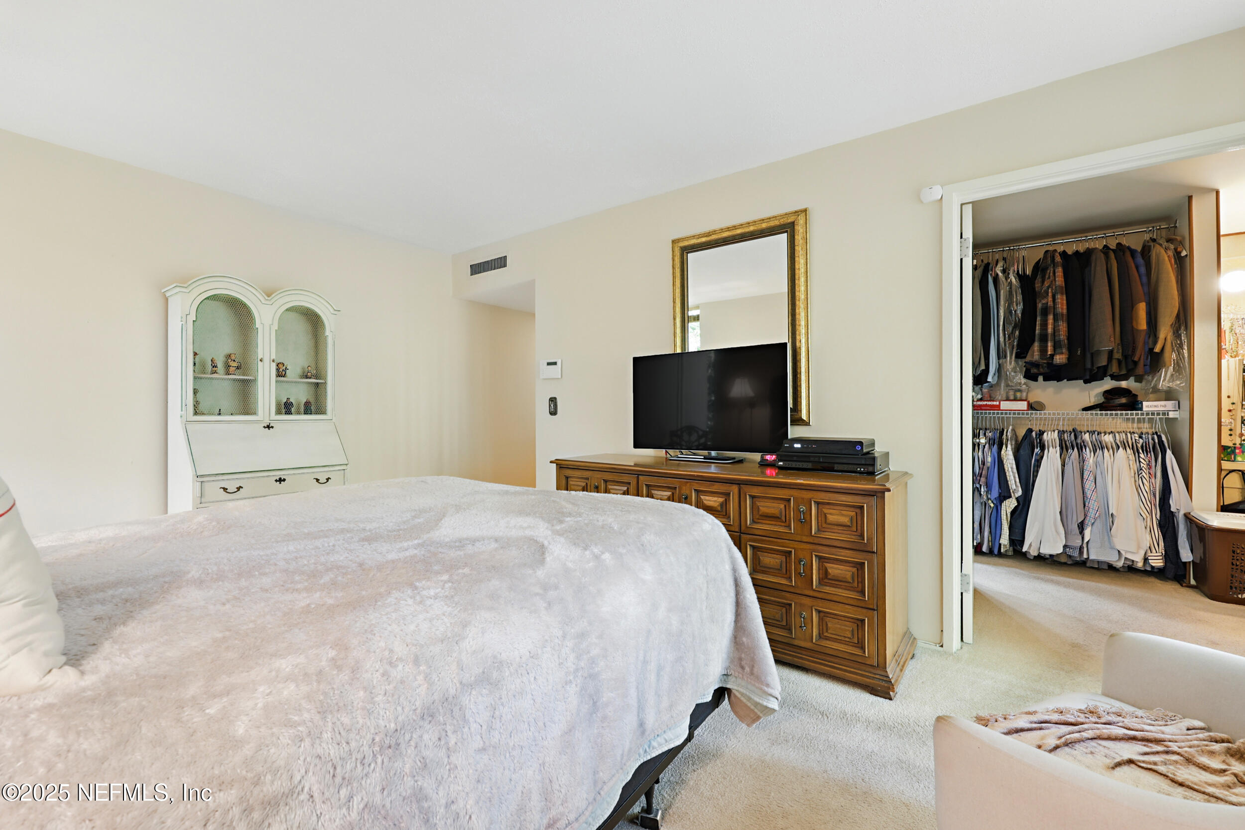 2916 Forest Circle Jacksonville, FL 32257 - Photo 34 of 64 a bedroom with a bed and a flat screen television
